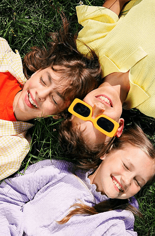 Family lying together smiling